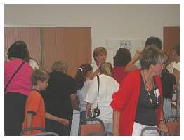 07 Sue Bradley counting 'Little Books' to sell & camera shy Cecelia Abbott.JPG